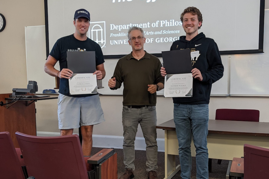 Ethics Bowl '22 - second place team Awesome Sauce Patrick Cassat, and Matthew Mcelroy with dept head Aaron Meskin 