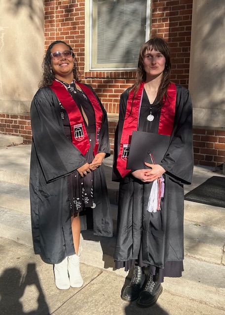 Diana Orrego-Jimenez and Lilian Kirk in graduation regalia