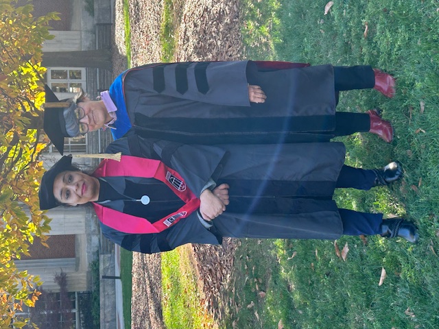 Dr. Gehad Abdelal and Dr. Chris Cuomo standing together in doctoral graduation robes